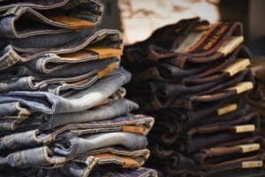 Two piles of jeans stacked nicely next to each other