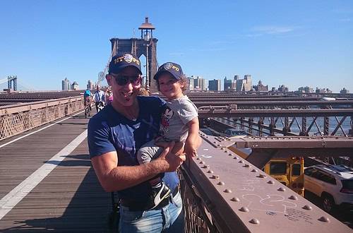 Dad carrying his toddler son on Brooklyn bridge