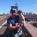 Dad carrying his toddler son on Brooklyn bridge